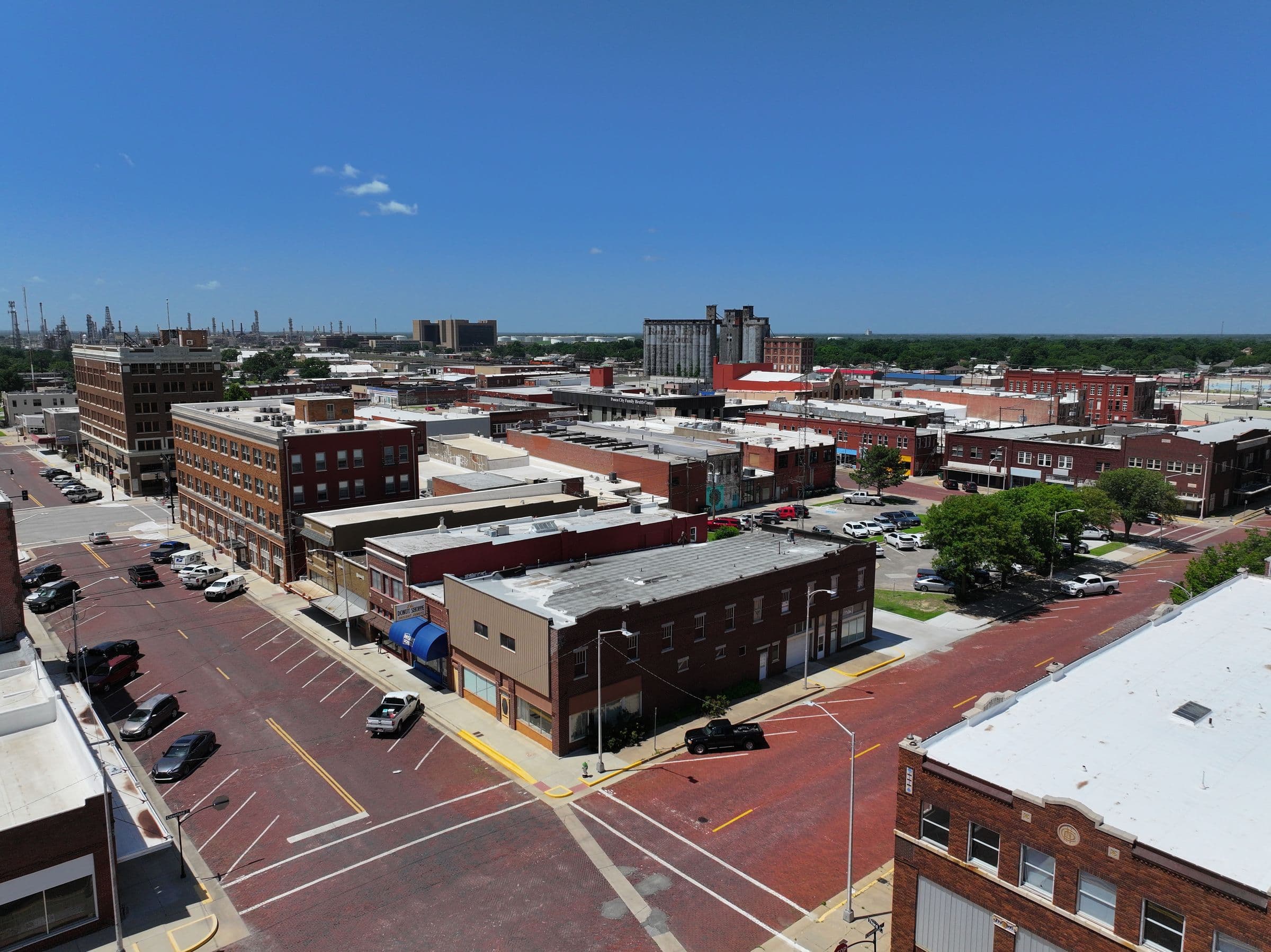 Aerial view of downtown Ponca City, Oklahoma, showing the red brick streets and historic storefronts